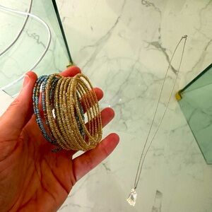 New Blue and gold bracelet of beads that stretch and wrap around wrist connected